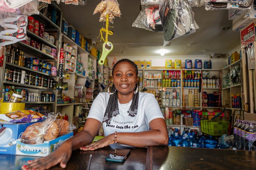An independent shop owner at the counter